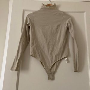 Skims, mock high neck full sleeve bodysuit, never worn